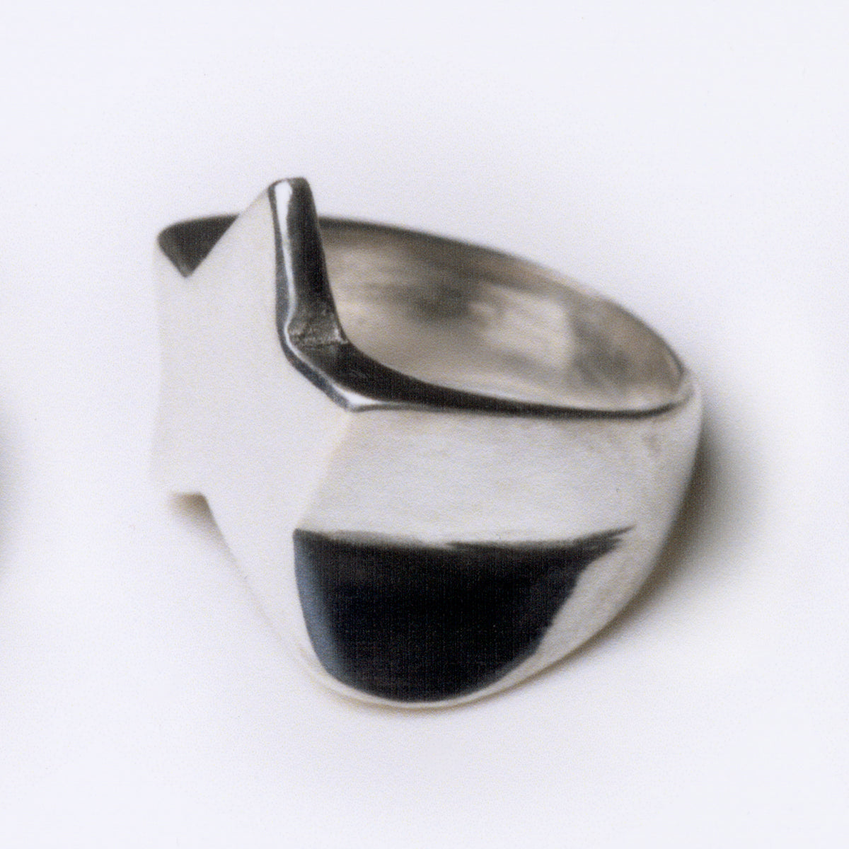 Silver star ring on a white background